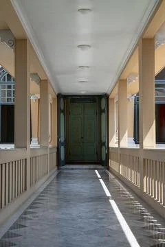 Perspective view of Long corridor with lantern ceiling and columns leading .. Stock Photos