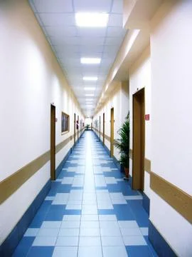 Perspective view of the long corridor at office centre Stock Photos