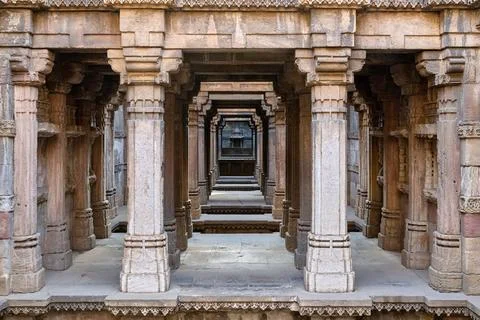 Perspective view looking through multiple levels of carved sandstone pillars  Фото