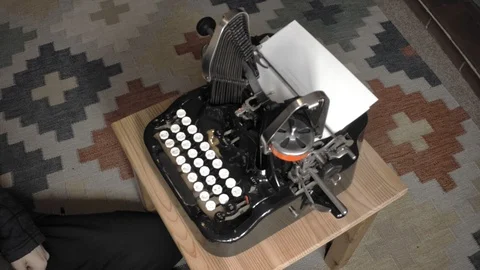 Perspective view on man using batwing typewriter. Antique steampunk machine Stock Footage 89313841