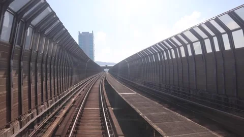Perspective view of mass rail transit train passing through tracks with sound Stock Footage 342274936