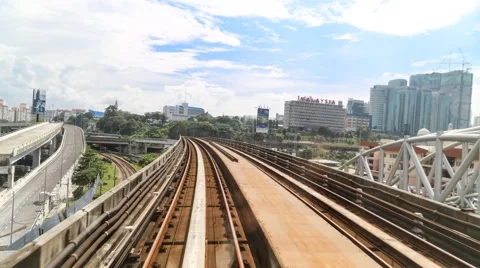 Perspective view of modern electric train journey on railway track and stations Stock Footage 57656070