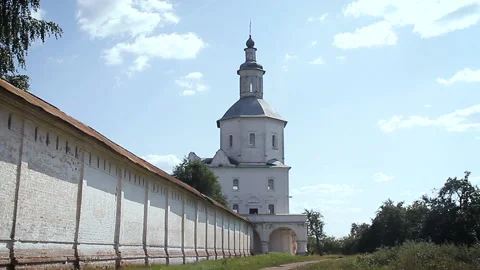A perspective view of the monastery wall and bell tower outside in summer. Stock Footage 139784658