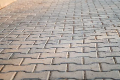 Perspective View Monotone Gray Brick Stone Pavement on The Ground for Street 写真素材
