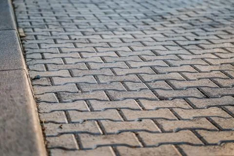 Perspective View Monotone Gray Brick Stone Pavement on The Ground for Street Stock Photos