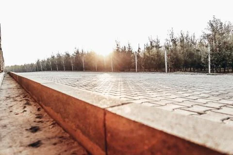 Perspective View Monotone Gray Brick Stone Pavement on The Ground for Street Stock Photos