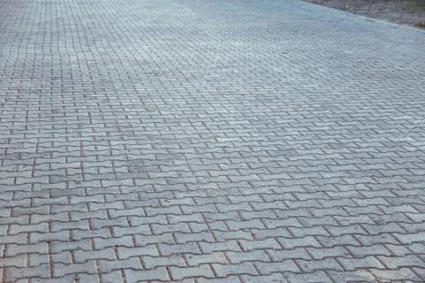 Perspective View Monotone Gray Brick Stone Pavement on The Ground for Street 写真素材