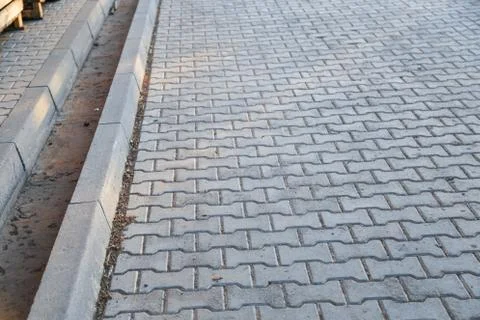 Perspective View Monotone Gray Brick Stone Pavement on The Ground for Street 写真素材