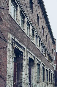 Perspective view of old brick building on gloomy day Stock Photos