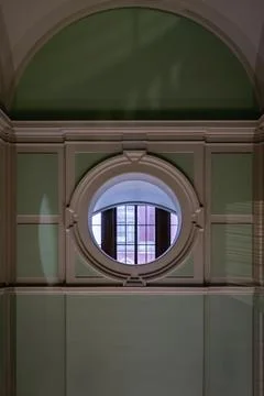 Perspective view of Round Shape Window in a green room at the Victoria and .. Stock Photos