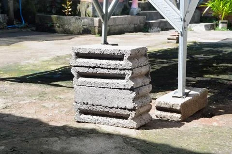 Perspective view of a stack of concrete bricks in a yard Stock Photos