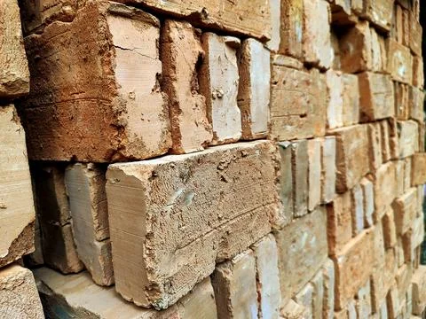 Perspective View of Stacked Rustic Clay Bricks Wall Stock Photos