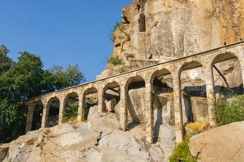 Perspective view of stone arcade stepping along a rocky slope with repeatin.. Stock Photos
