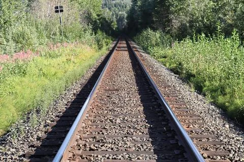 Perspective view of a train track diminishing into the distance Stock Photos