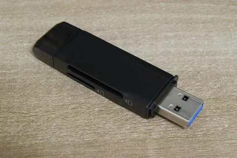 Perspective view of USB card reader on wooden desk Fotos de archivo