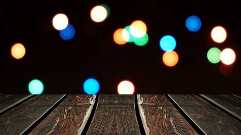 Perspective wood and bokeh background of night and the shimmering glare of the Stock Footage 77406416