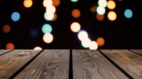 Perspective wood and bokeh background of night and the shimmering glare of the Stockbeeldmateriaal 77408421