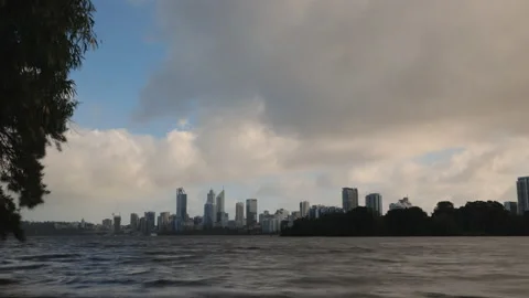 Perth City on windy day - clouds fly overhead with rough waters in foreground Stock-Footage 158968503