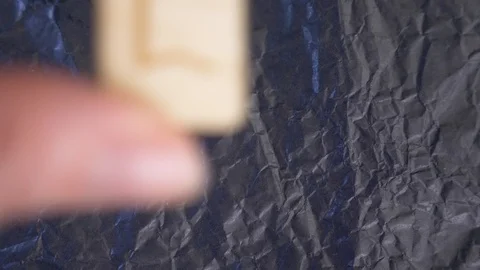 Perth rune. close-up, hand puts the rune on the surface for divination. 4k, slow Stock Footage 87879931