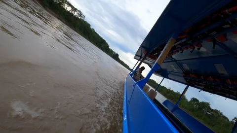 Peru Amazon Hyperlapse Boat Going down Amazon River Dutch Angle Stock Footage 128831249