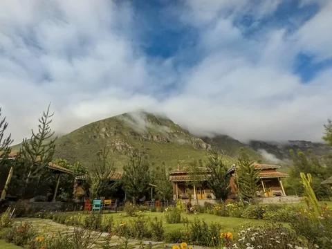 Peru, Day Clouds Behind Mountain from Resort, Timelapse 6K Stock Footage 128207739