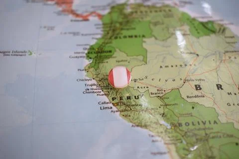 Peru flag drawing pin on the map Stock Photos