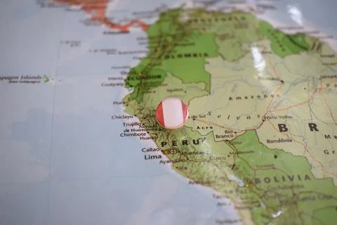 Peru flag drawing pin on the map Stock Photos
