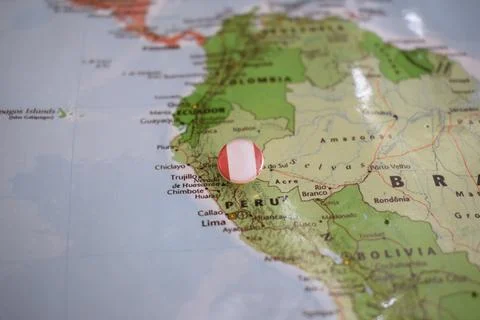 Peru flag drawing pin on the map Stock Photos