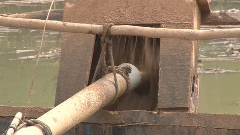 Peru illegal gold mining in the Amazon close up pump Stock Footage 86323684