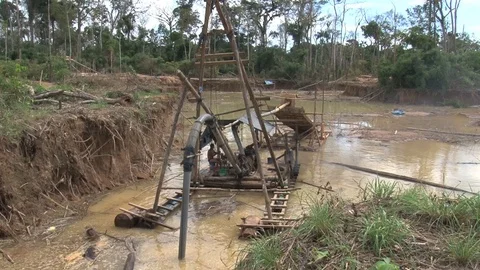 Peru illegal gold mining in the Amazon miners at work in water Stock Footage 86324260