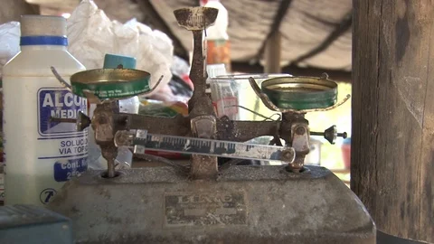 Peru illegal gold mining in the Amazon weighing gold Stock Footage 86325808