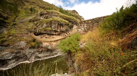 PERU: Inca grass bridge over the river Apurimac in peruvian Andes Stock Footage 60602495