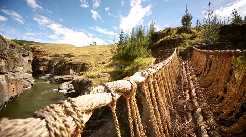 PERU: Inca grass bridge over the river Apurimac in peruvian Andes Stock Footage 60977142