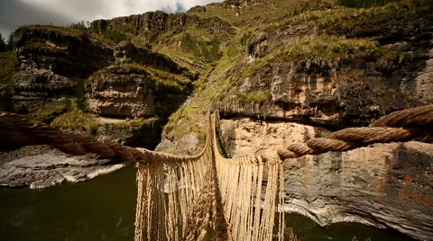 PERU: Inca grass bridge over the river Apurimac in peruvian Andes Stock Footage 62466704