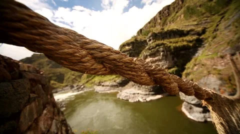 PERU: Inca grass bridge over the river Apurimac in peruvian Andes Stock Footage 63479831