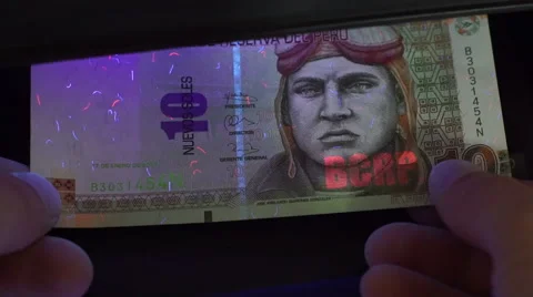 Peru Money Ten Soles Blacklight Counterfeit Check Closeup Stock Footage