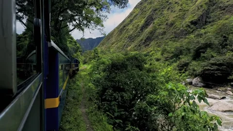 Peru Rail train turning Urubamba river power lines Machu Picchu Inca Trail Stock Footage 325846045