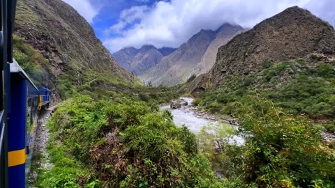 Peru Rail train turning Urubamba river high flow Machu Picchu Inca Trail Aguas Stock Footage 325971268