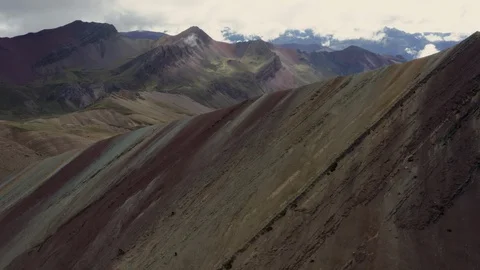 Peru Rainbow Mountain 4K Drone Wrap around crescent reveal valley and sunrise Stock Footage 127605436