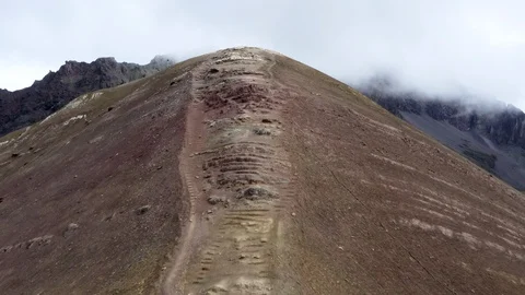 Peru Rainbow Mountain Drone Slow Boom Over reveal beautiful mountain clouds Stockbeeldmateriaal 127718824