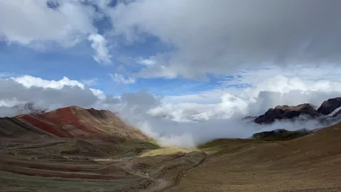 Peru, Rainbow Mountain, Wide Timelapse of Clouds Rolling In Stock Footage 128207799