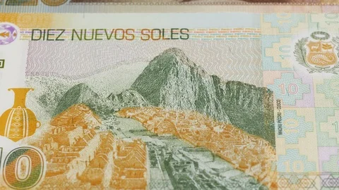 Peru sol banknotes tracking. Peruvian money. Slider shot. Low angle, 4K Stock Footage 126724180