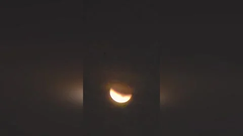 Peru: Total Lunar Eclipse Paints Crimson Sky Over Lima Stock Footage 330078901