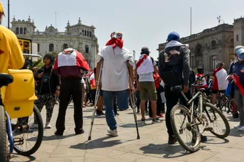 Peruviam people protesting with the flag Stock Photos