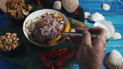 Peruvian ceviche served with chicha morada and fried calamari Stock Footage 339078027