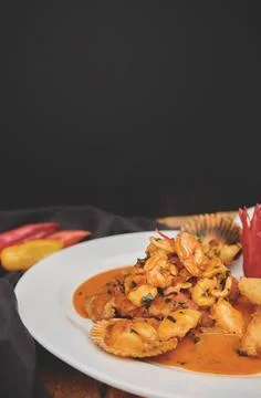Peruvian culinary fried fish A lo Macho style with seafood sauce Foto stock