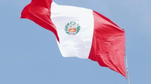 Peruvian flag flying with blue sky in the background. Concept of patriotism. Stock Footage 221950150