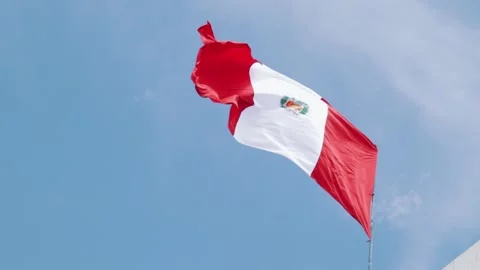 Peruvian flag flying with blue sky in the background. Concept of patriotism. Stock Footage 221950225