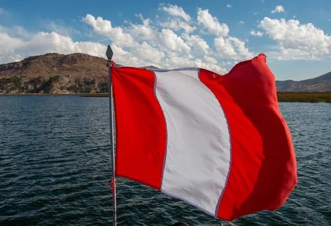 Peruvian Flag flying over Lake Titicaca, Puno, Peru Stock Photos