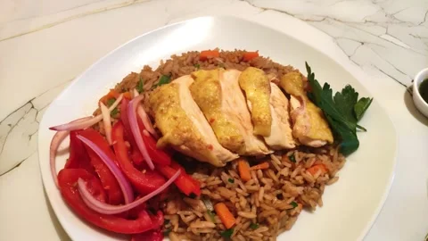 Peruvian fried chicken with rice and tomato salad called "Pollo con arroz". Видео 285361684